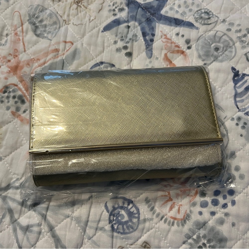 Beautiful Brand new in packaging small crossbody purse with cellphone window